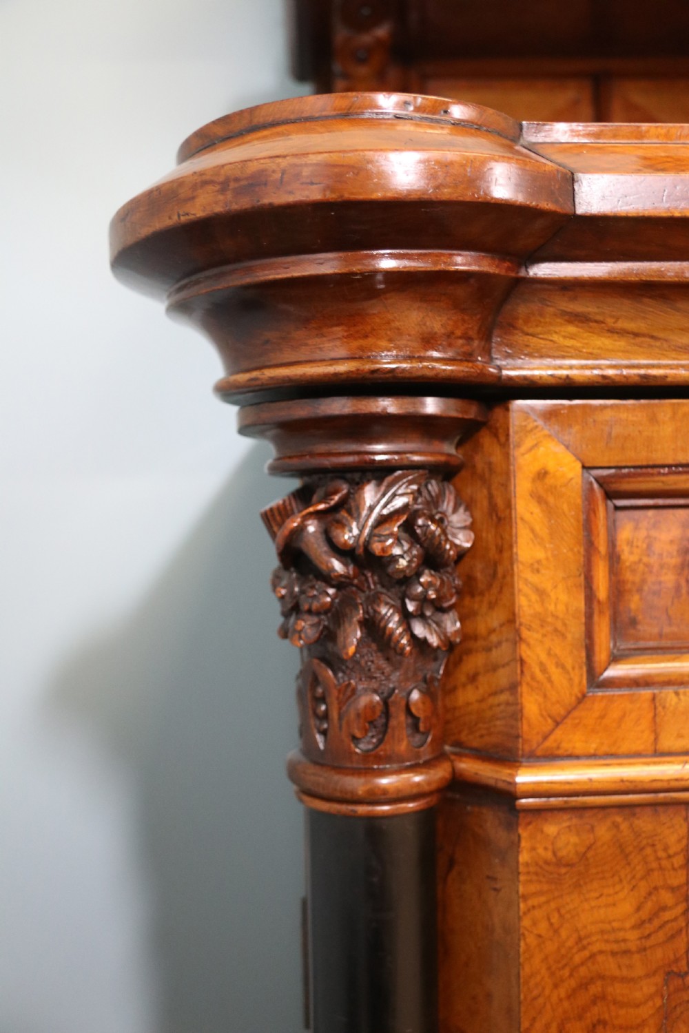 A Victorian Gothic Revival sideboard crafted from pollard oak featuring intricate geometric wood inlays, turned black columns, twin pedestal cupboards, and a tiered upper superstructure. View XV