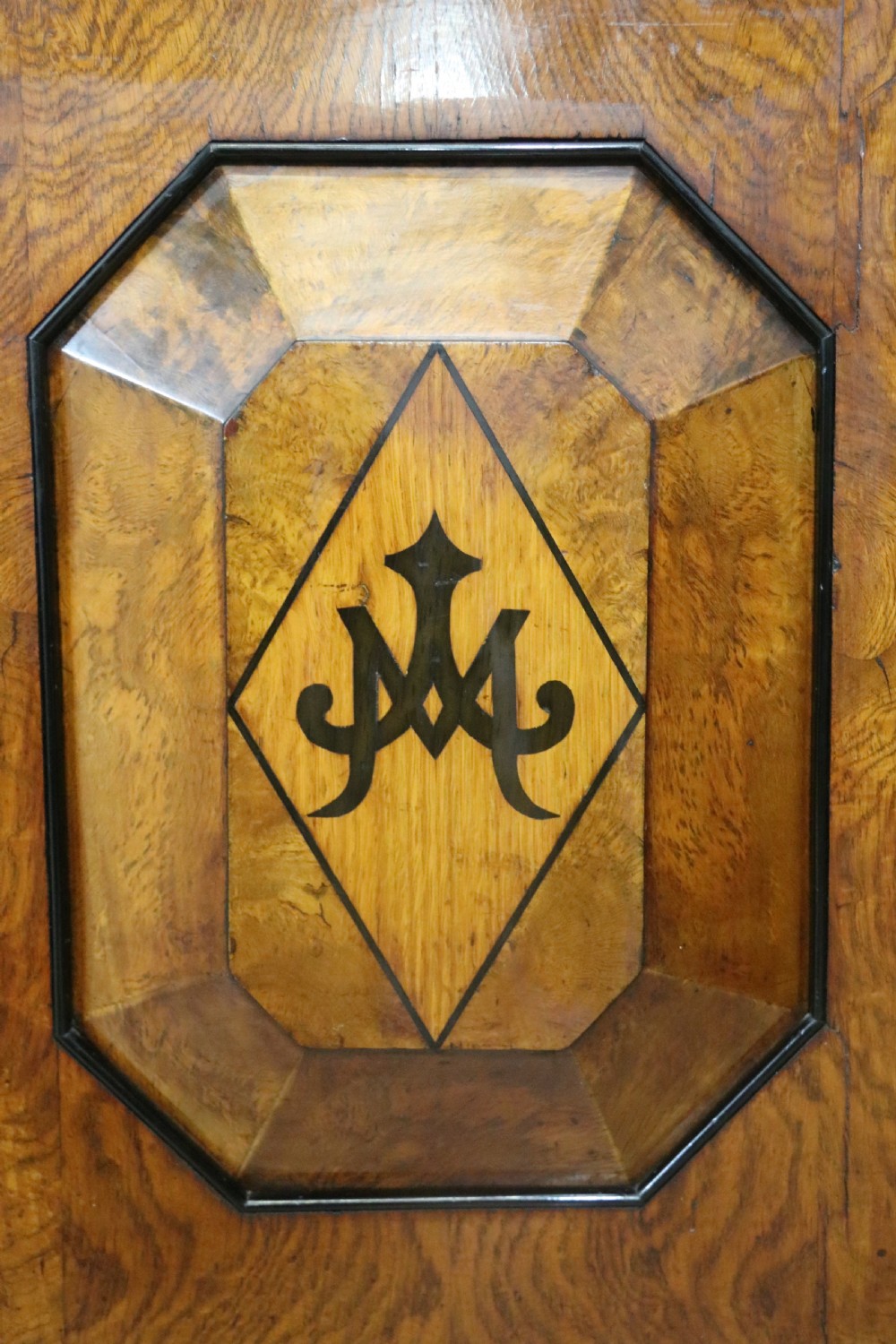 A Victorian Gothic Revival sideboard crafted from pollard oak featuring intricate geometric wood inlays, turned black columns, twin pedestal cupboards, and a tiered upper superstructure. View XVI