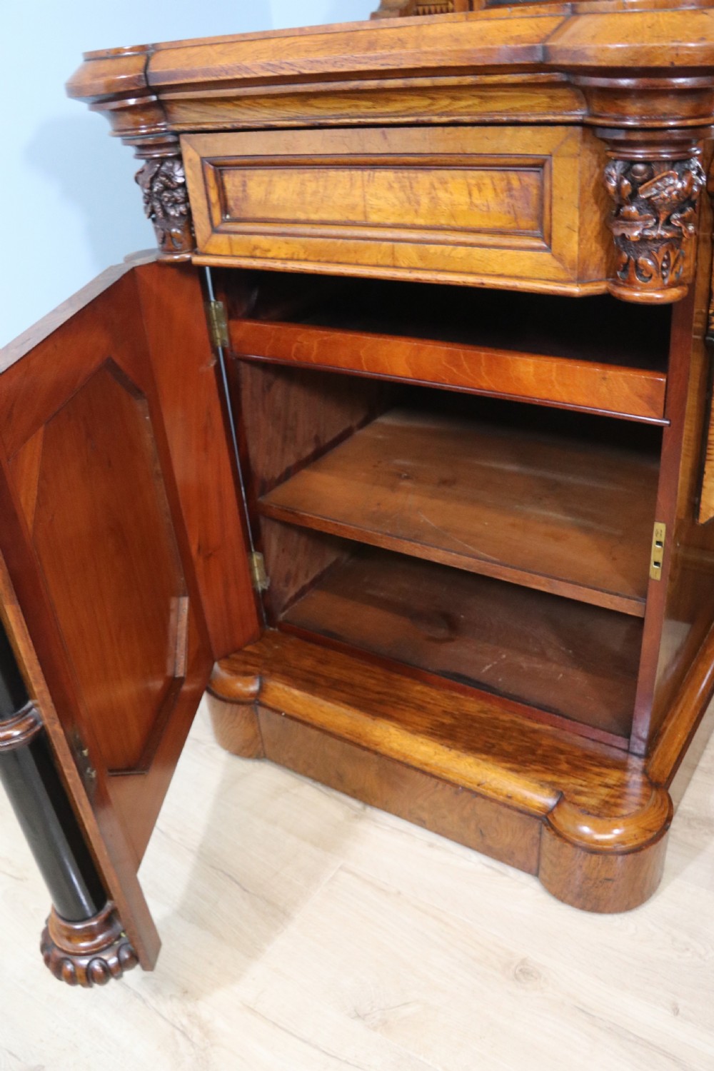 A Victorian Gothic Revival sideboard crafted from pollard oak featuring intricate geometric wood inlays, turned black columns, twin pedestal cupboards, and a tiered upper superstructure. View XVII