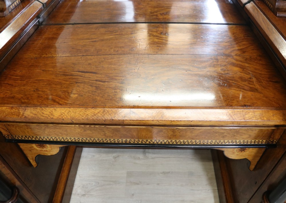 A Victorian Gothic Revival sideboard crafted from pollard oak featuring intricate geometric wood inlays, turned black columns, twin pedestal cupboards, and a tiered upper superstructure. View XX