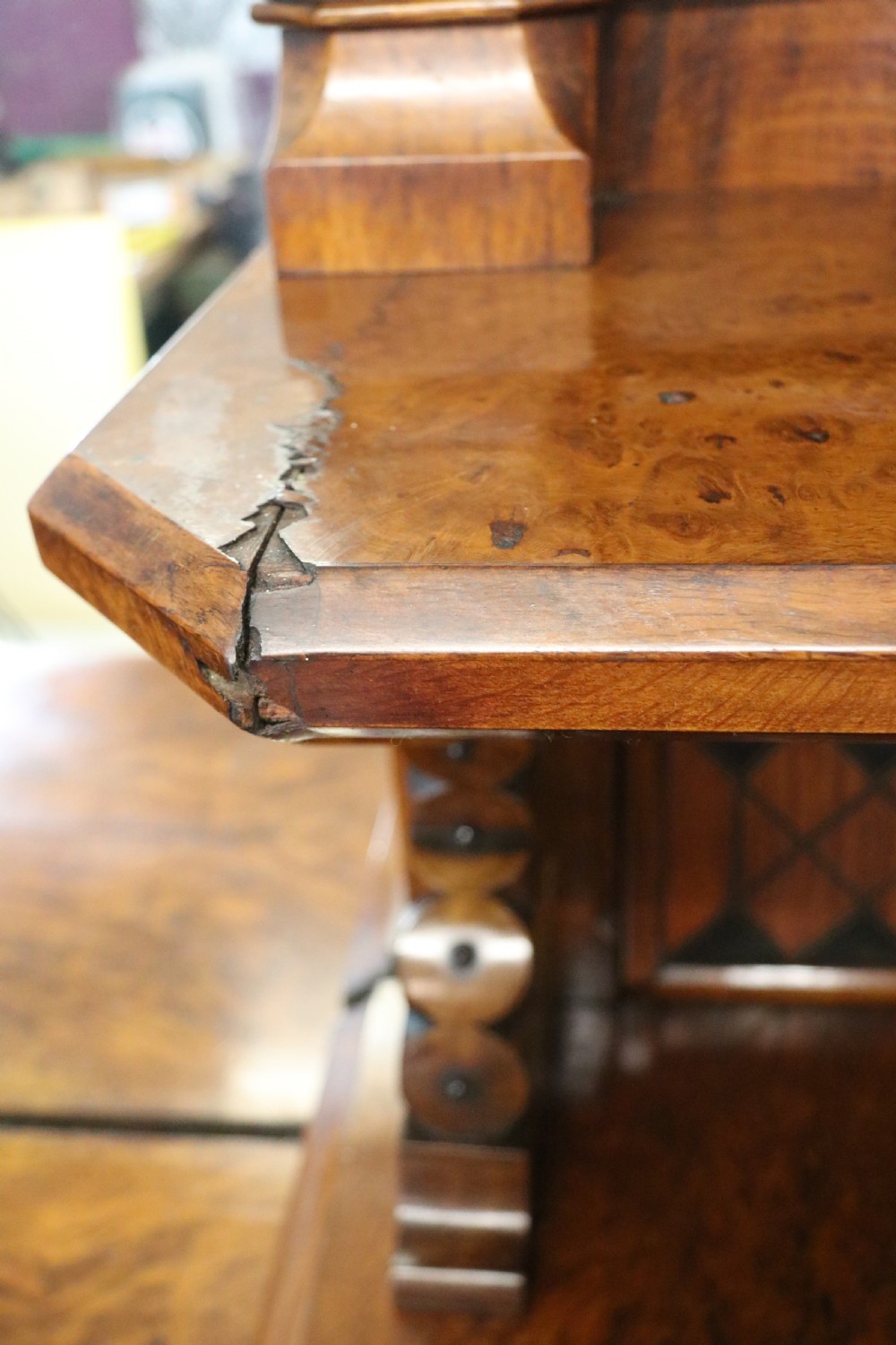 A Victorian Gothic Revival sideboard crafted from pollard oak featuring intricate geometric wood inlays, turned black columns, twin pedestal cupboards, and a tiered upper superstructure. View XXI