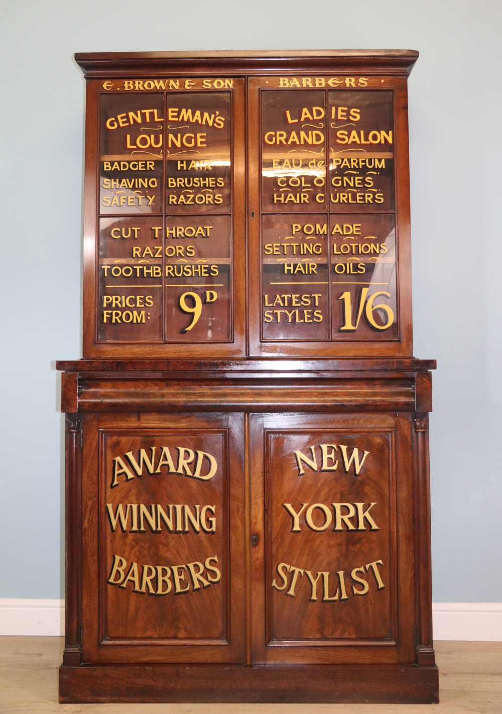 A fine sophisticated Victorian bookcase cabinet with later advertising sign written detail. View II