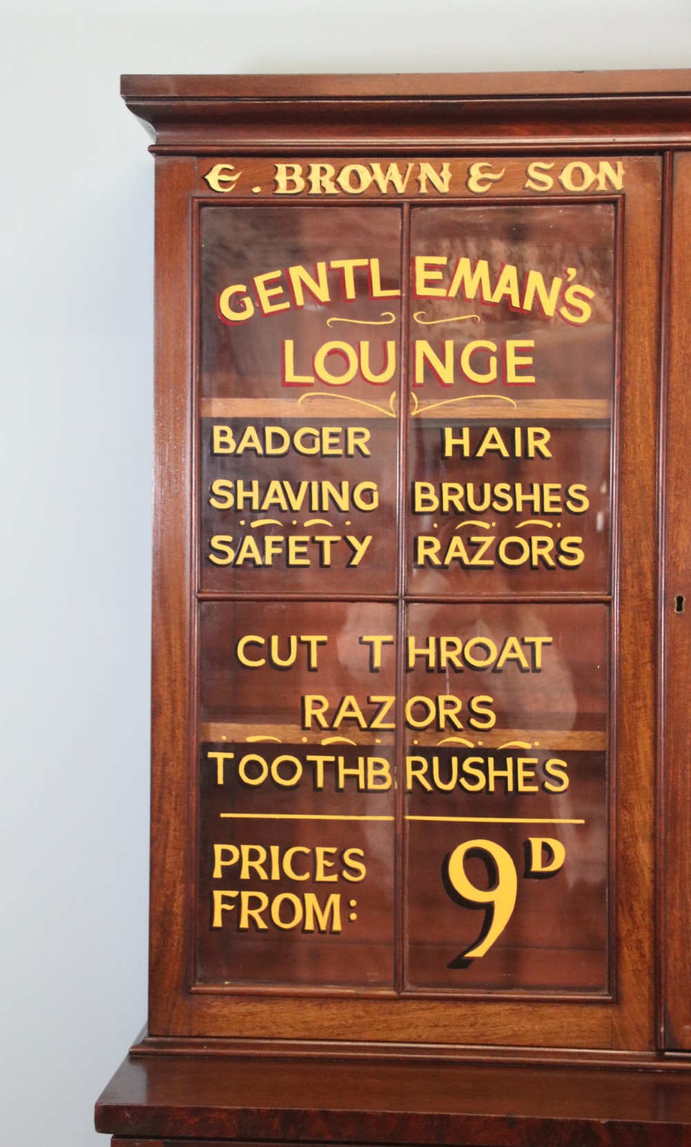 A fine sophisticated Victorian bookcase cabinet with later advertising sign written detail. View IV