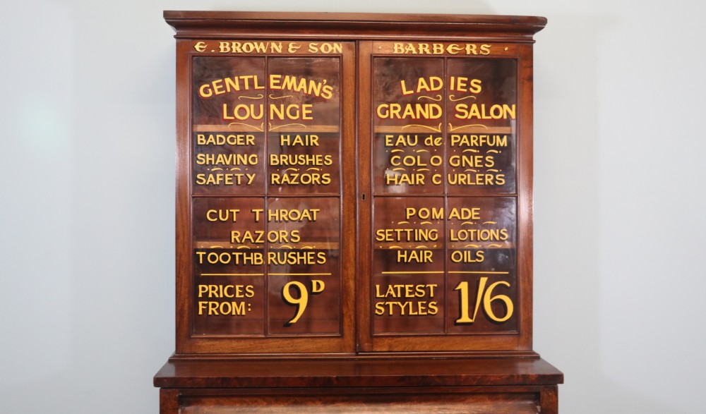 A fine sophisticated Victorian bookcase cabinet with later advertising sign written detail. View VI