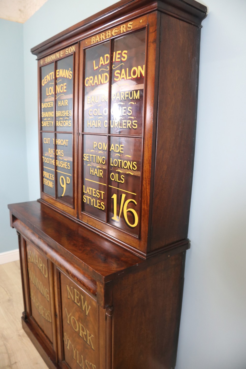 A fine sophisticated Victorian bookcase cabinet with later advertising sign written detail. View VII