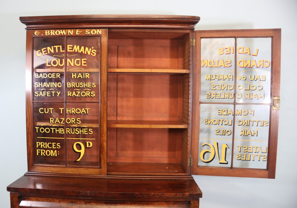 A fine sophisticated Victorian bookcase cabinet with later advertising sign written detail. View VIII