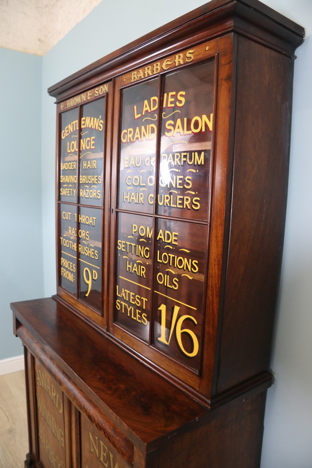 A fine sophisticated Victorian bookcase cabinet with later advertising sign written detail. View X