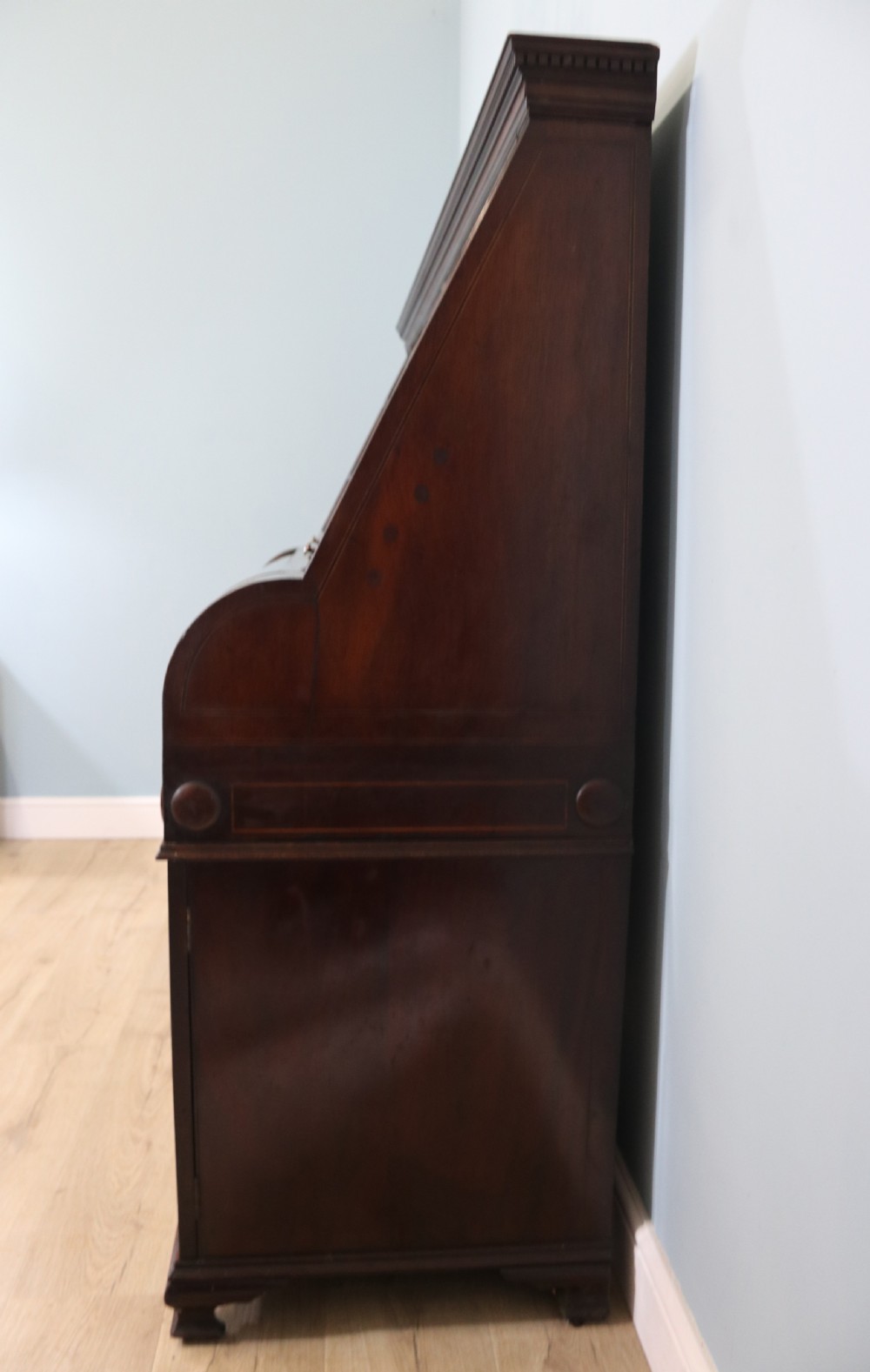 An early nineteenth-century mahogany twin pedestal display cabinet featuring glazed upper doors with geometric glazing bars, a central curved glass display section, and inlaid pedestal cupboards below. View VIII