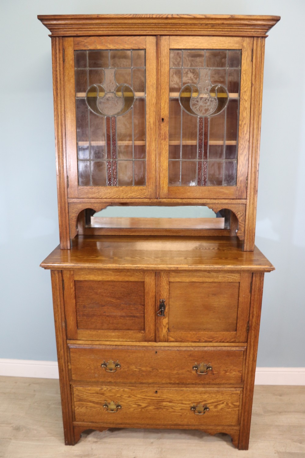 19th century light oak side cabinet in the Arts and Crafts style.