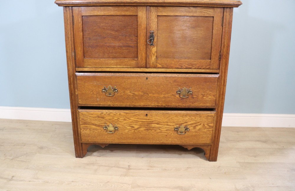 19th century light oak side cabinet in the Arts and Crafts style. View V
