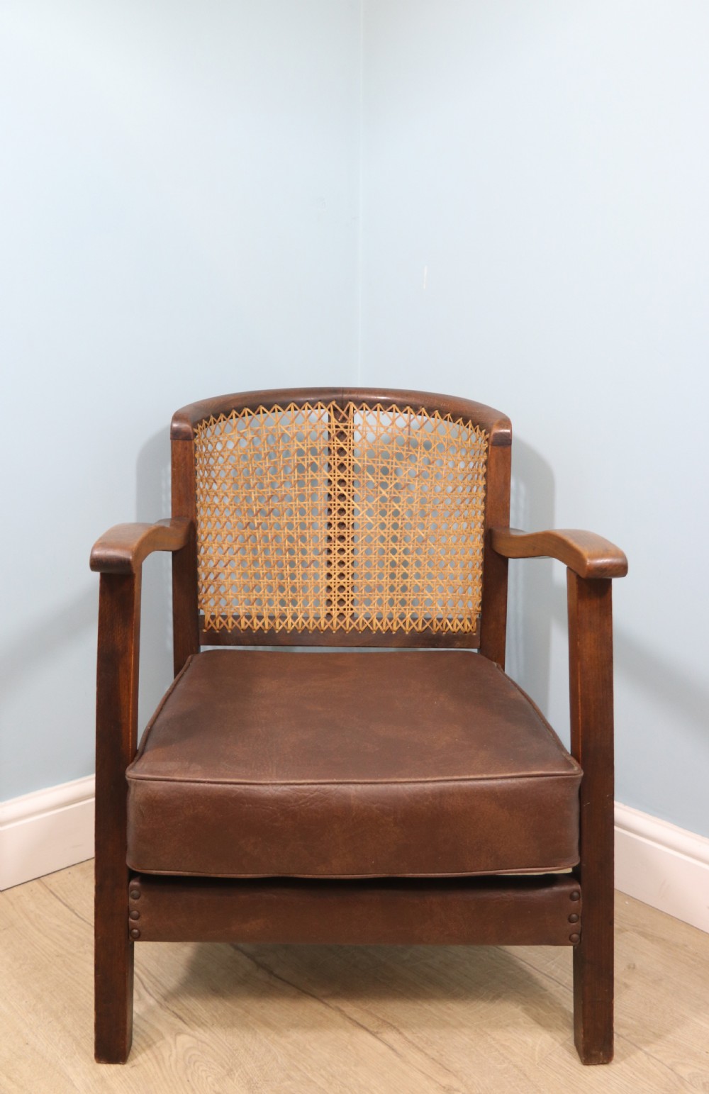 Early 20th century small beech framed cane back bergère chair.
