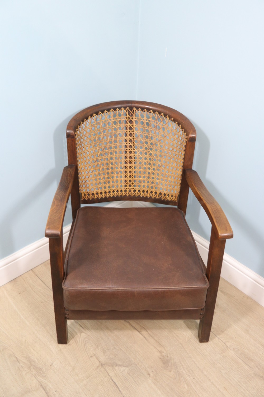 Early 20th century small beech framed cane back bergère chair. View II