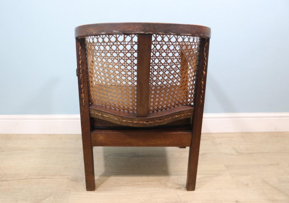 Early 20th century small beech framed cane back bergère chair. View IV