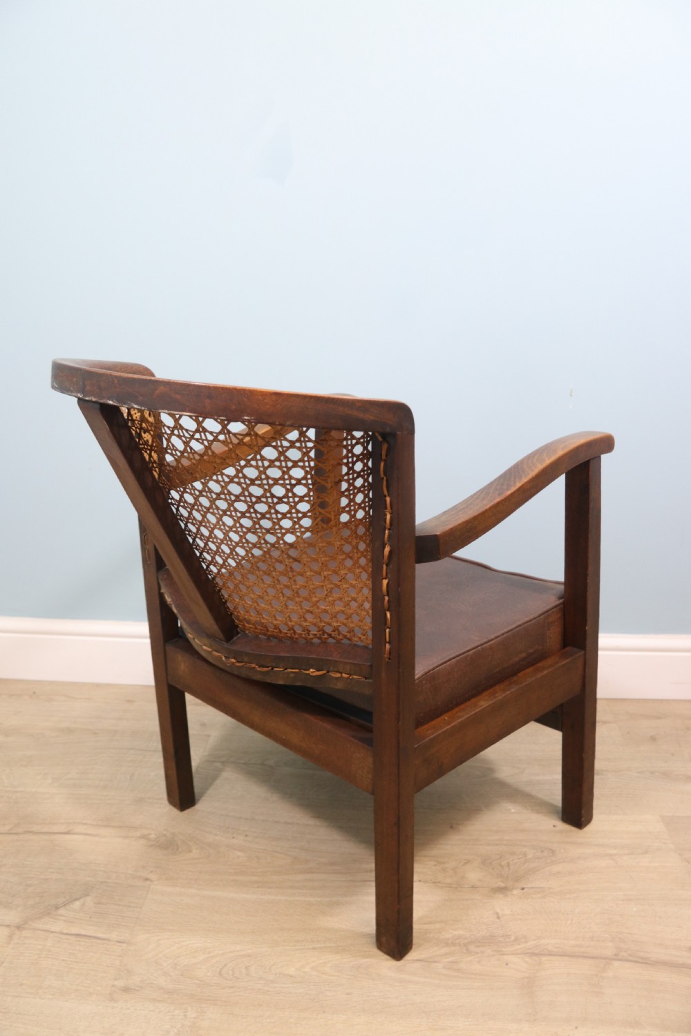 Early 20th century small beech framed cane back bergère chair. View VI