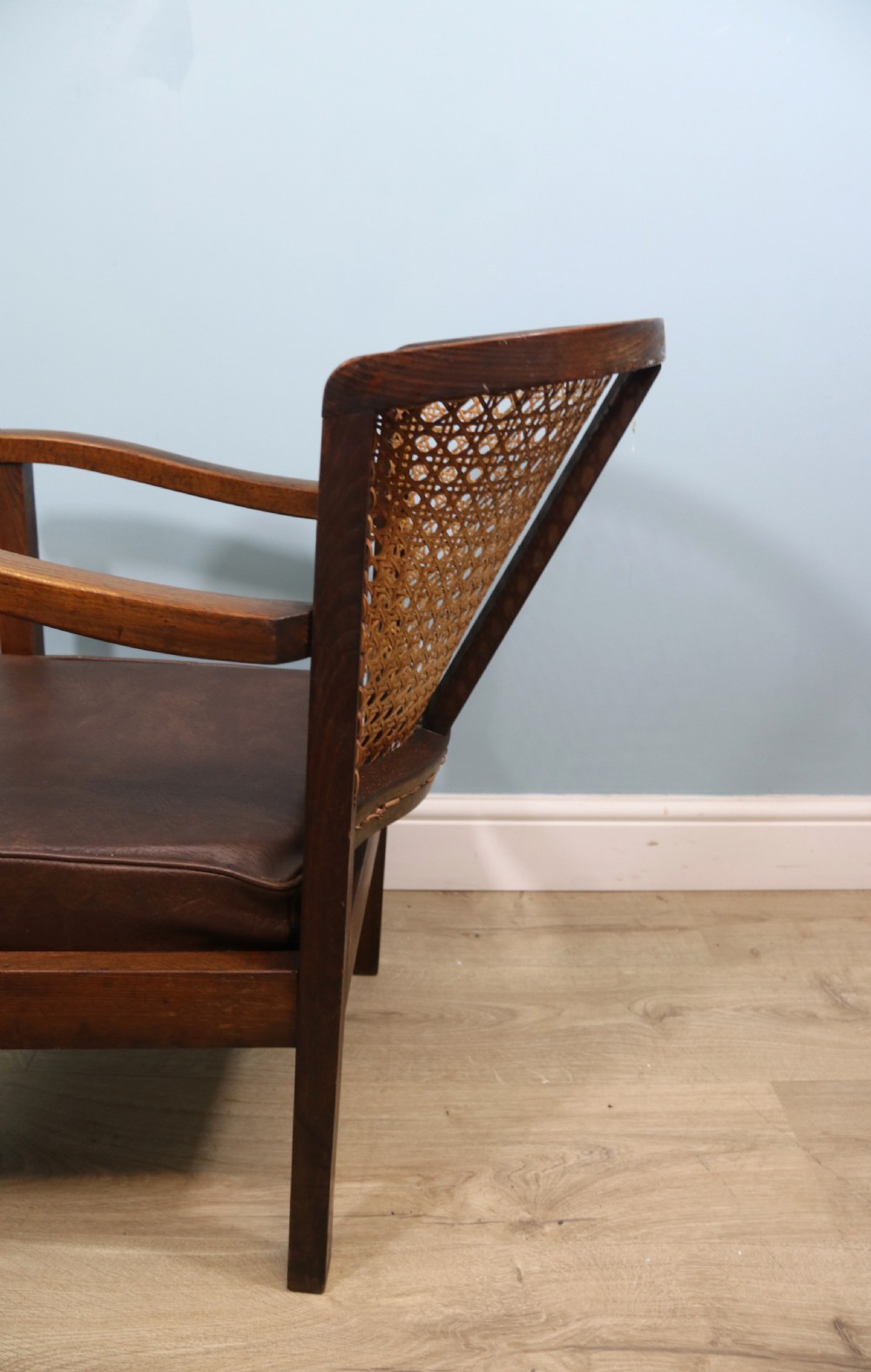 Early 20th century small beech framed cane back bergère chair. View VII