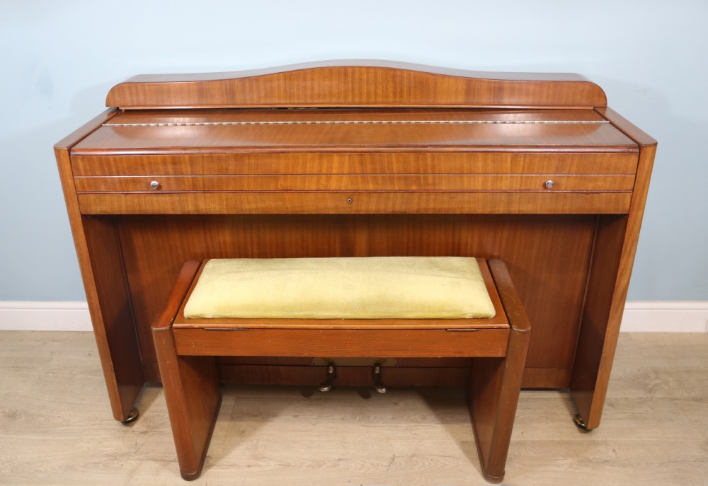 stylish Eavestaff mini piano and stool