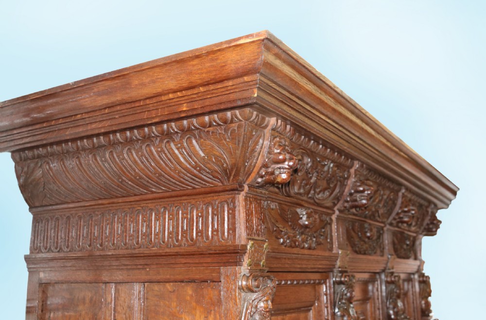 A totally magnificent 19th century oak court cupboard in the gothic style View II