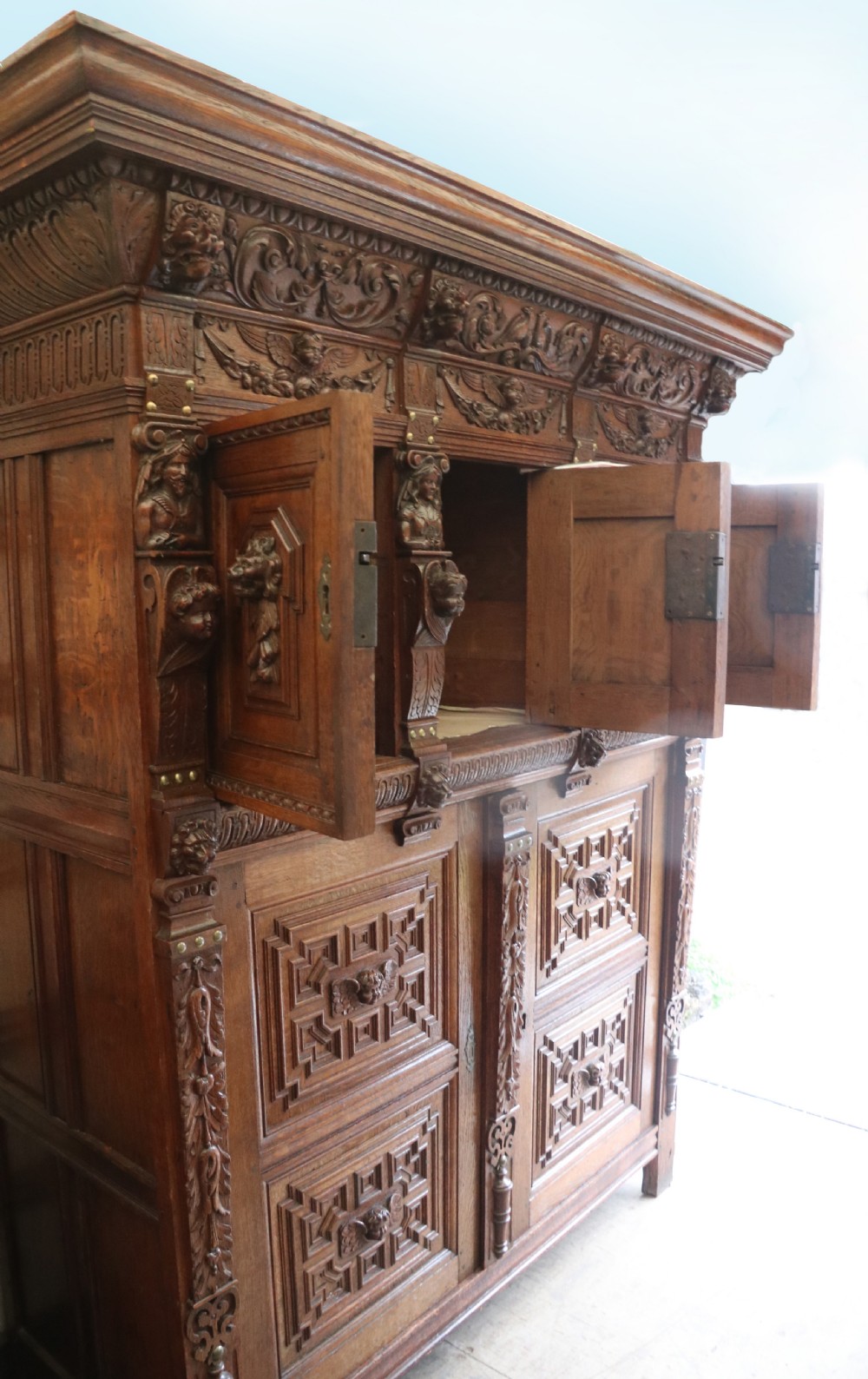 A totally magnificent 19th century oak court cupboard in the gothic style View IV