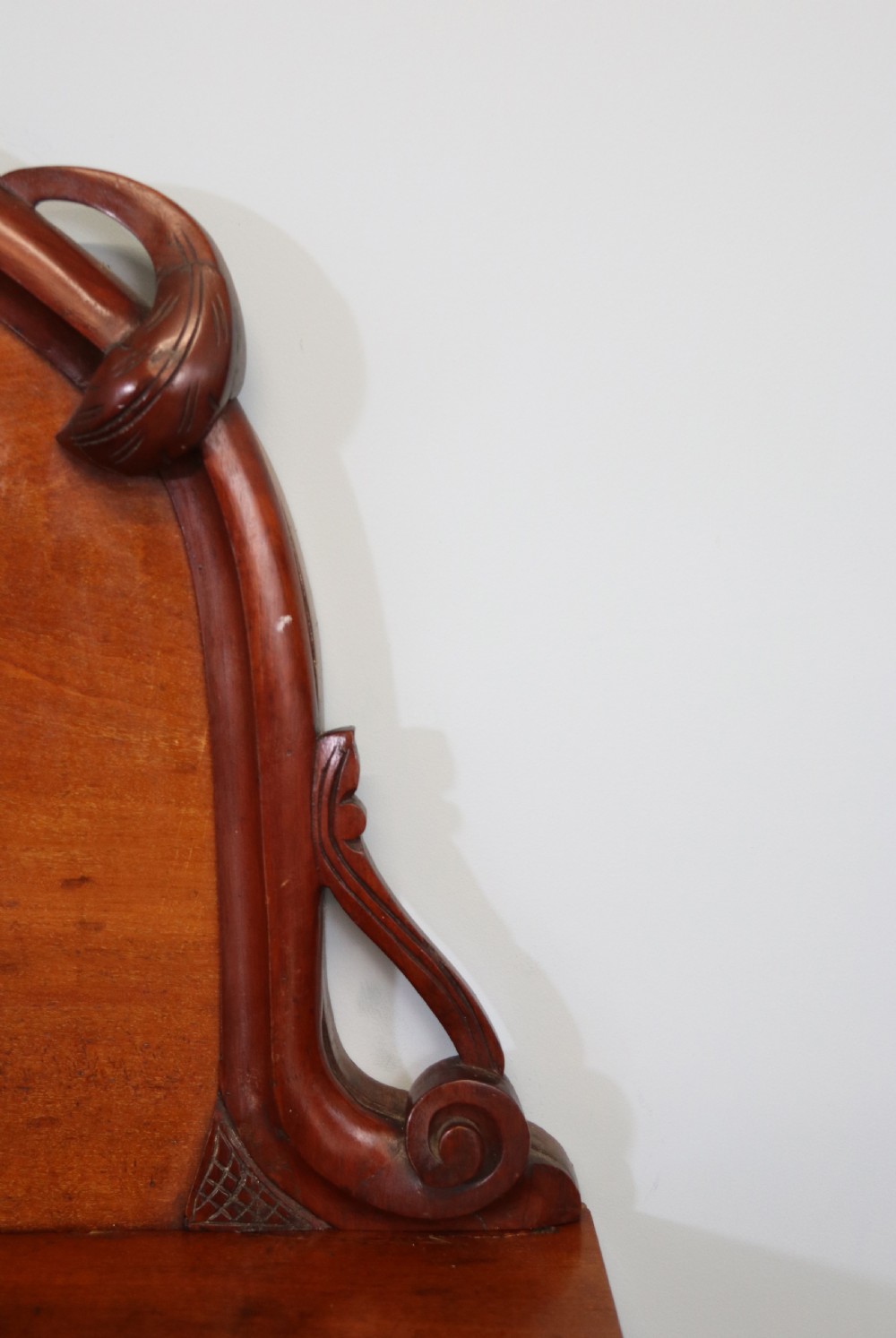 A Victorian mahogany chiffonier featuring hand-painted cream and red commercial typography across the upper cresting back and lower cupboard doors. View VIII