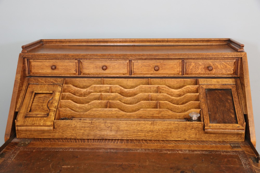 This fine Jacobean revival solid light oak bureau View XIII