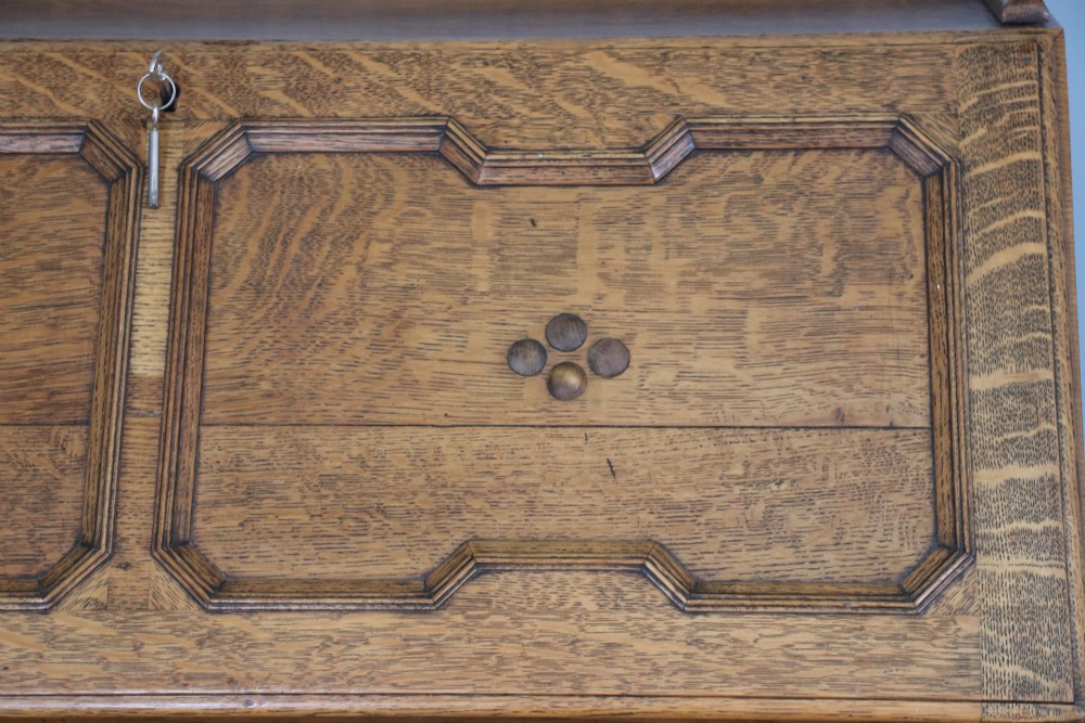 This fine Jacobean revival solid light oak bureau View XVI