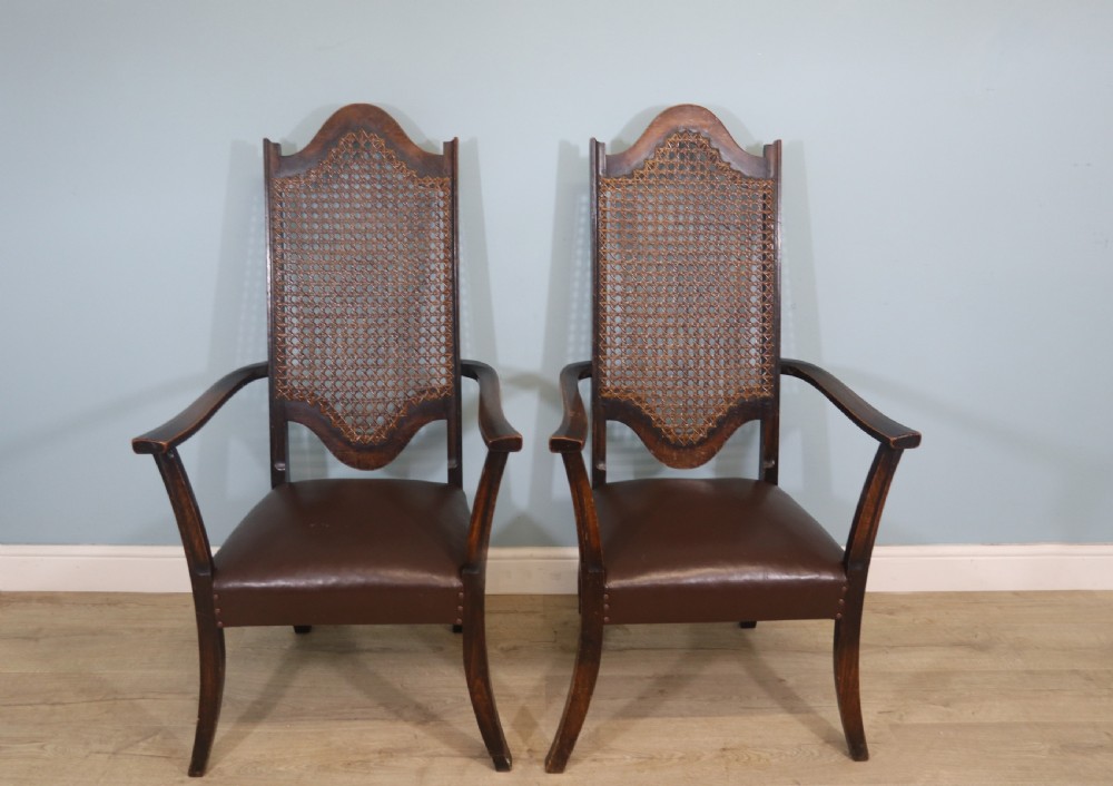 A lovely pair of early 20th century industrial looking cane shield back armchairs View II