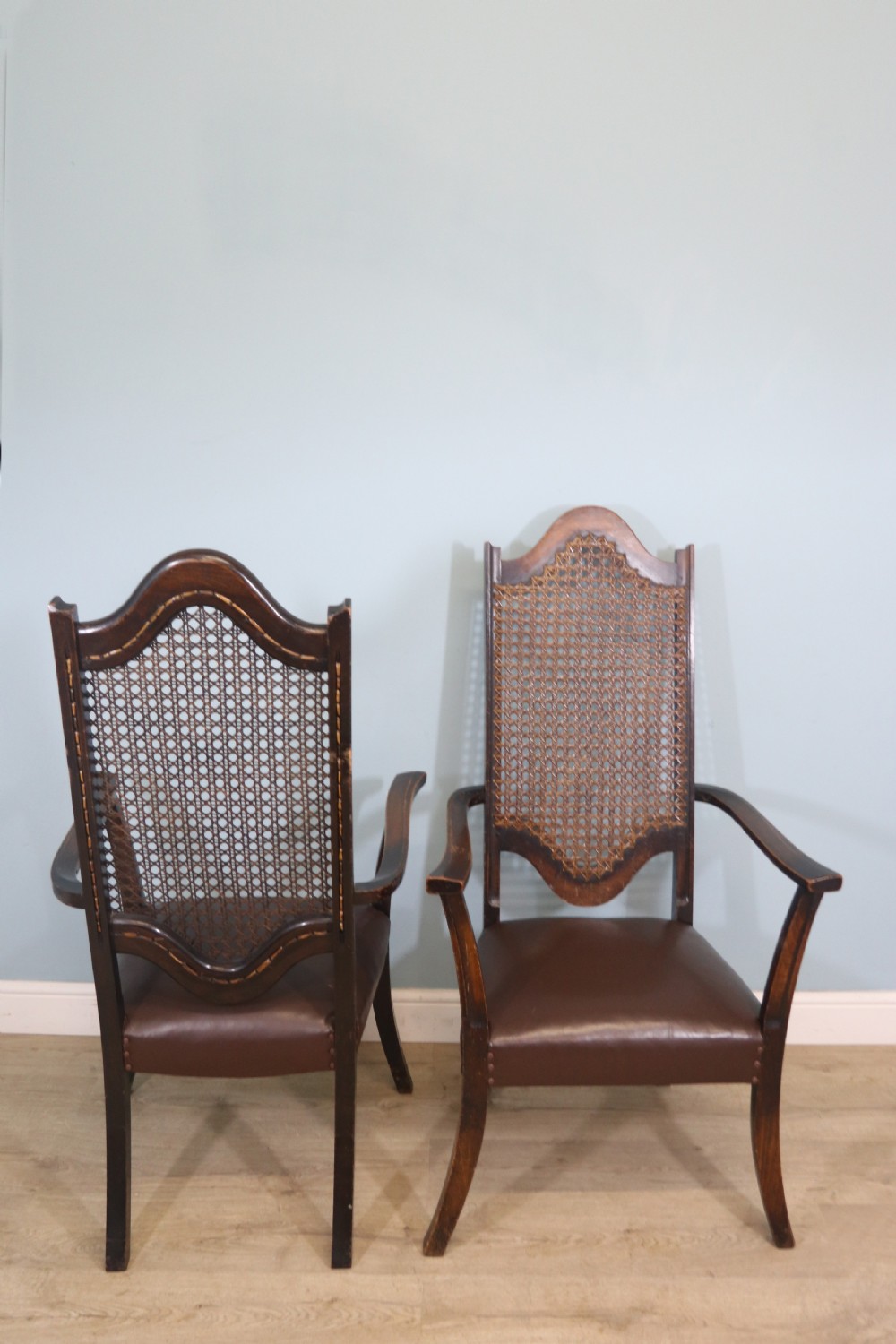 A lovely pair of early 20th century industrial looking cane shield back armchairs View III