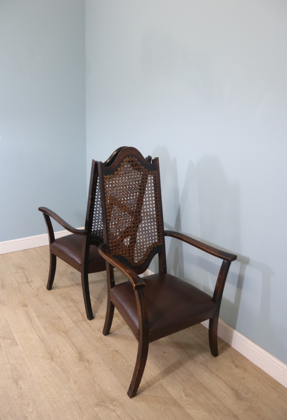 A lovely pair of early 20th century industrial looking cane shield back armchairs View V