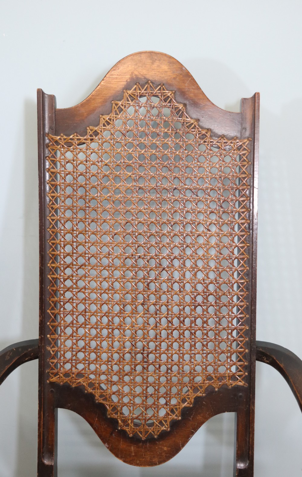 A lovely pair of early 20th century industrial looking cane shield back armchairs View VI