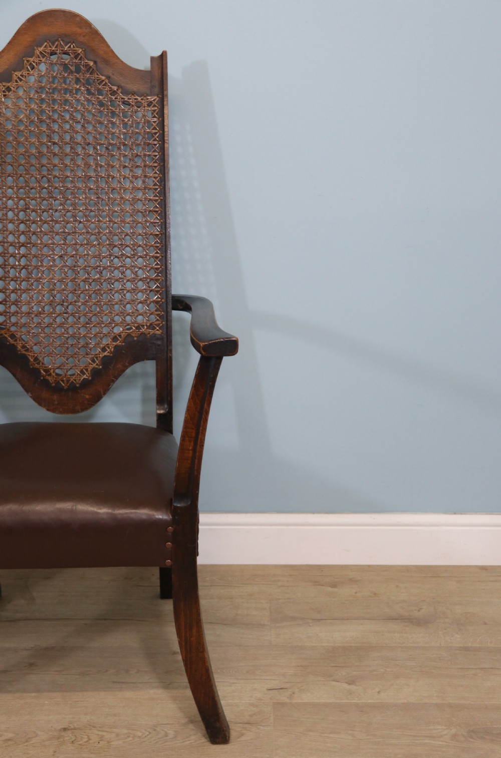 A lovely pair of early 20th century industrial looking cane shield back armchairs View VII