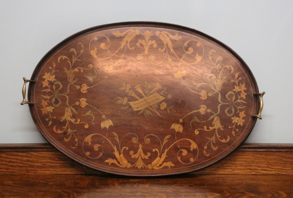 A lovely Edwardian mahogany and inlaid oval galleried tea tray