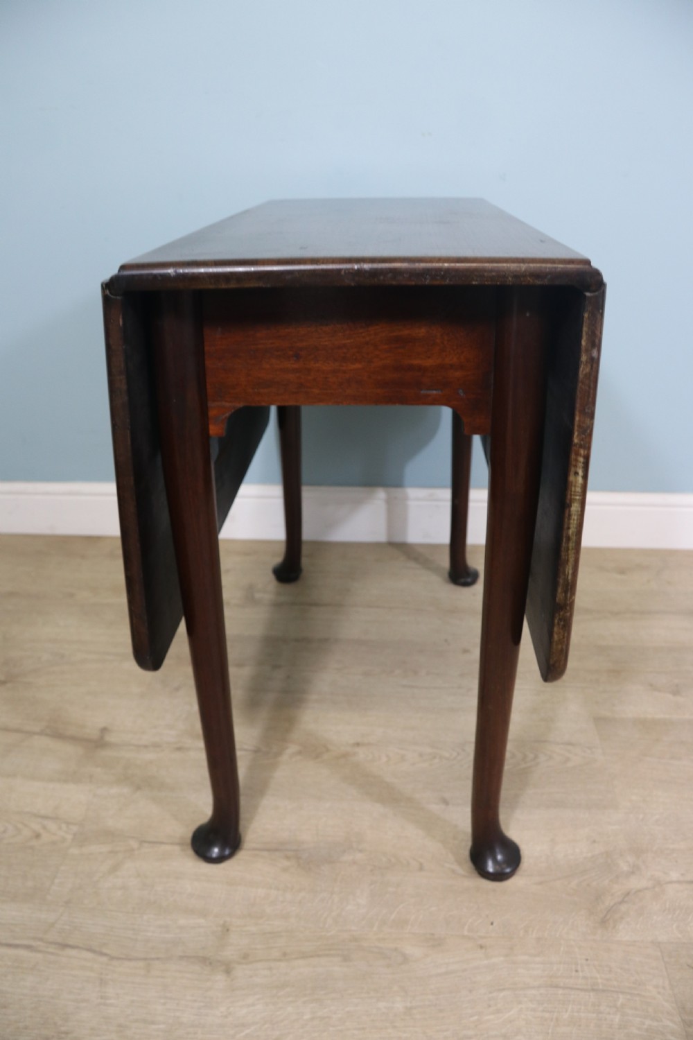 Lovely dropleaf table is made from solid mahogany View V