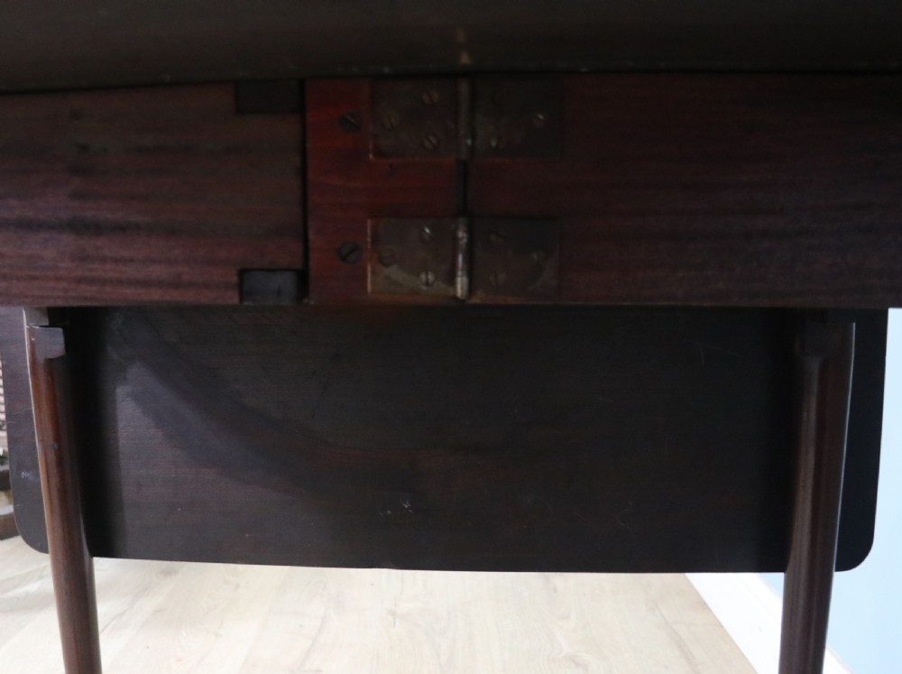 Lovely dropleaf table is made from solid mahogany View X
