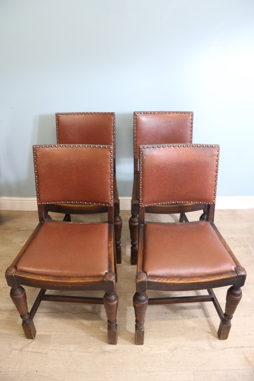 A set of four oak framed dining chairs dating from the 1930s View II