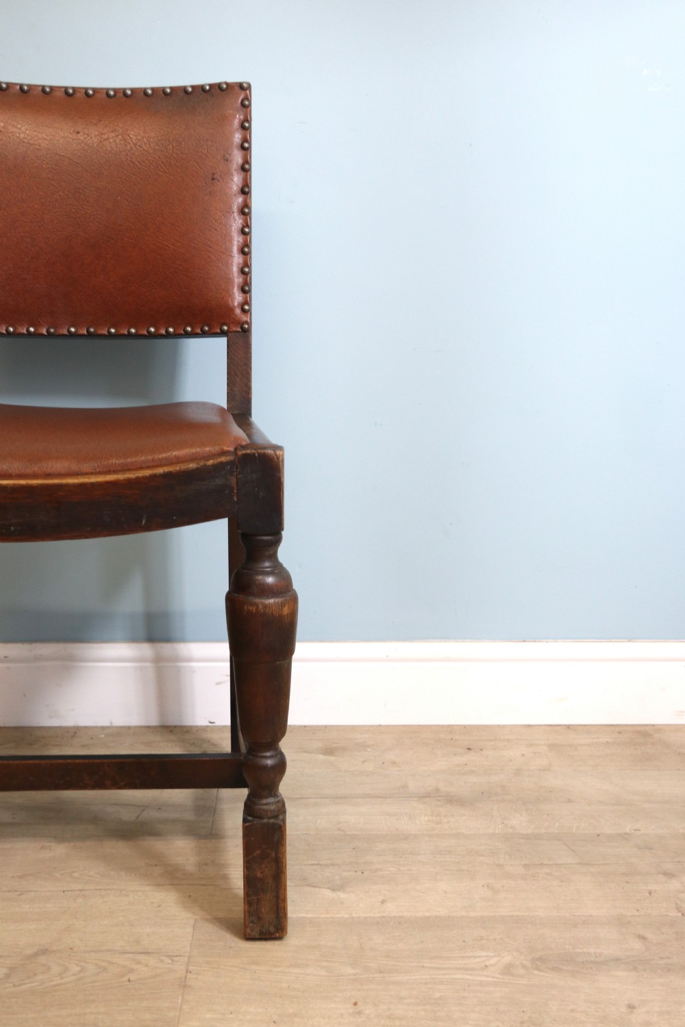A set of four oak framed dining chairs dating from the 1930s View V
