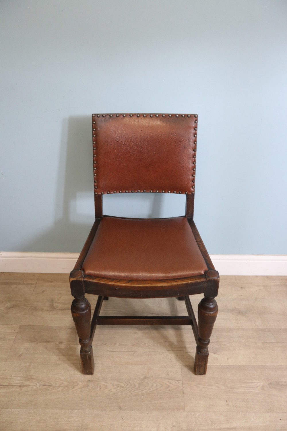 A set of four oak framed dining chairs dating from the 1930s View VI
