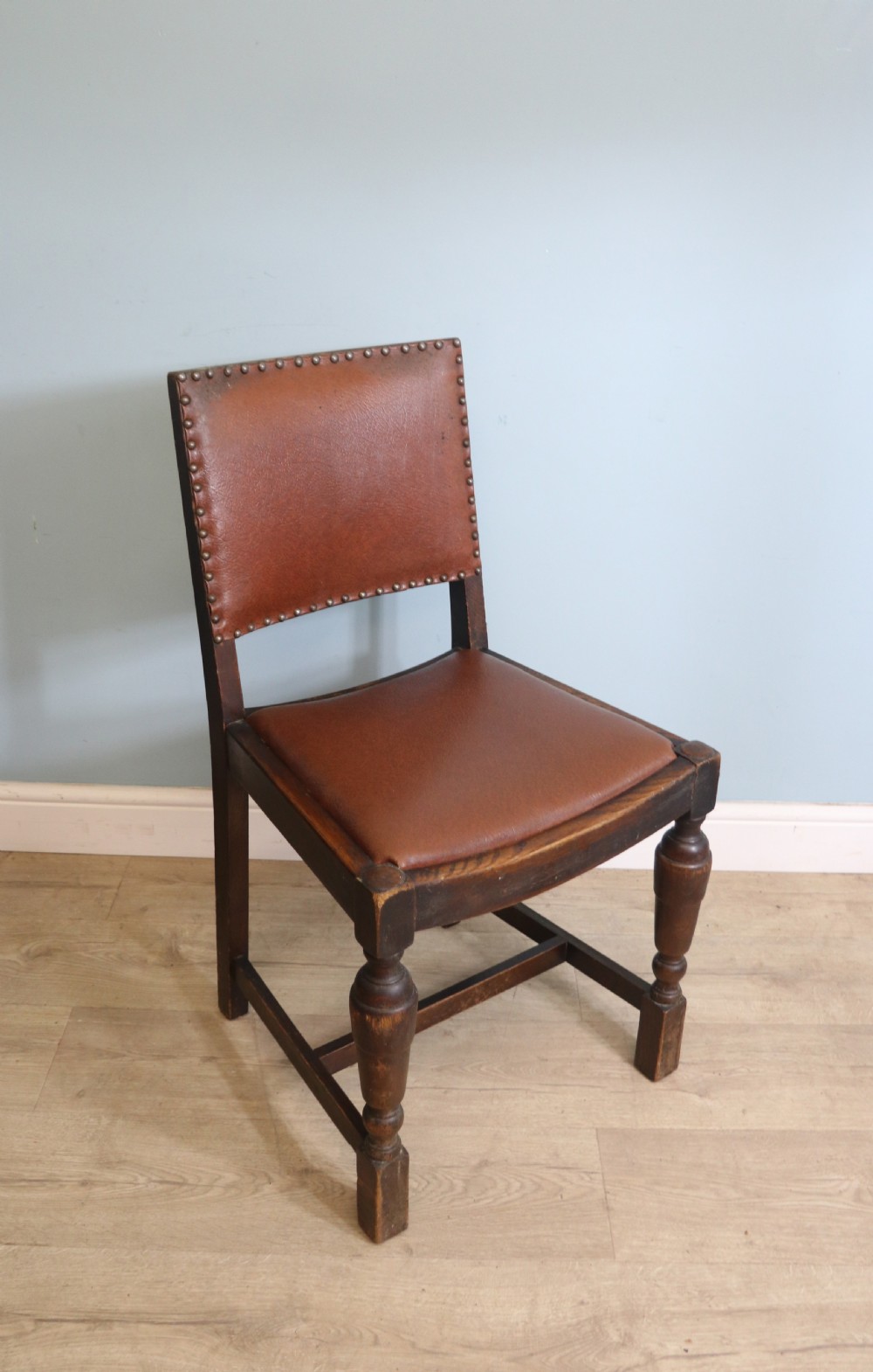 A set of four oak framed dining chairs dating from the 1930s View VII