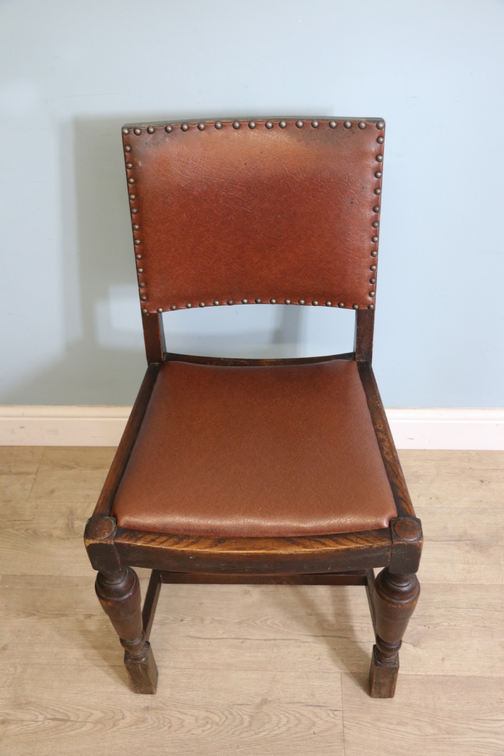 A set of four oak framed dining chairs dating from the 1930s View VIII