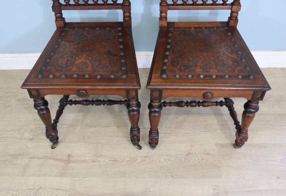 A lovely pair of Victorian oak framed dining or side chairs.  View VII