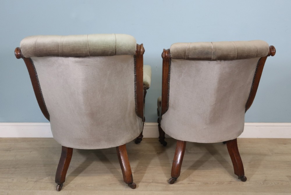 A six-piece late 19th-century chair suite featuring two button-back upholstered armchairs and four matching side chairs upholstered in taupe velvet with turned wooden front legs on castors. View VIII