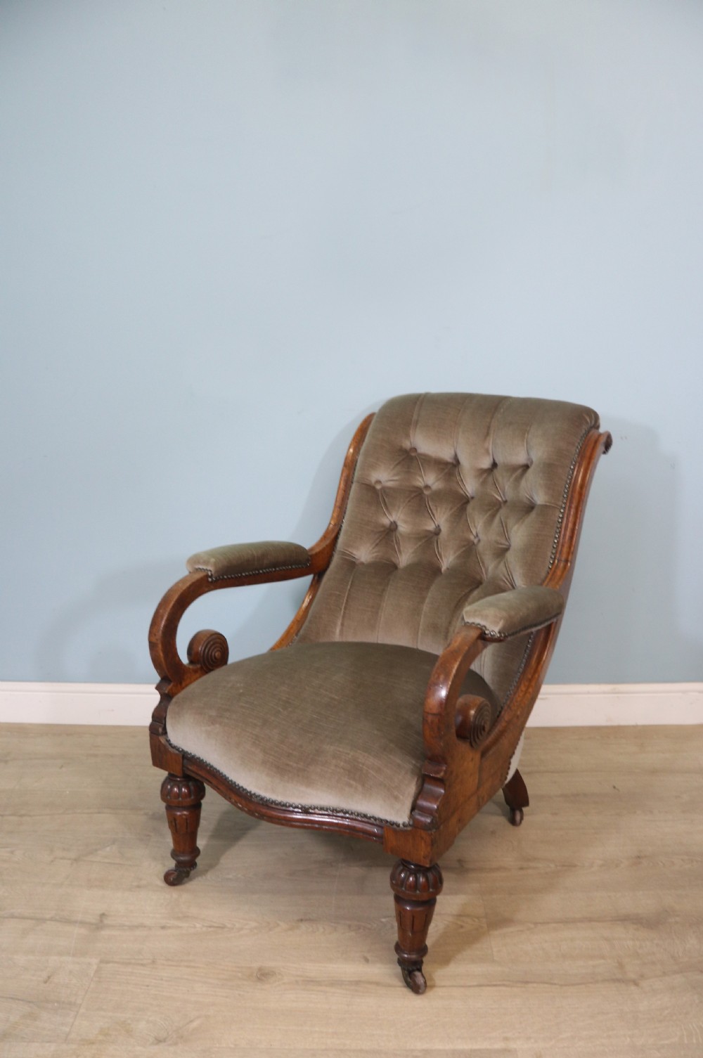 A six-piece late 19th-century chair suite featuring two button-back upholstered armchairs and four matching side chairs upholstered in taupe velvet with turned wooden front legs on castors. View XI