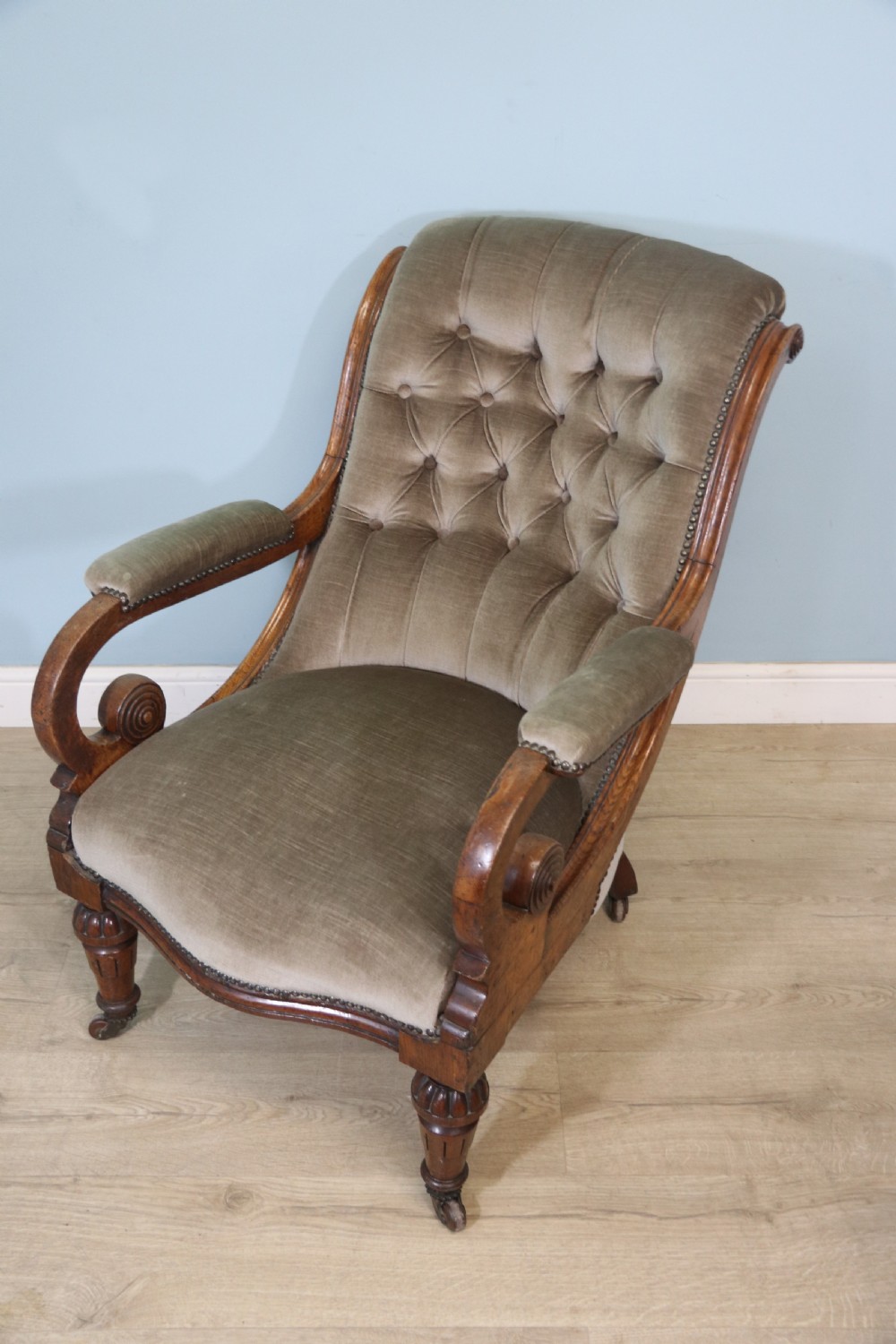 A six-piece late 19th-century chair suite featuring two button-back upholstered armchairs and four matching side chairs upholstered in taupe velvet with turned wooden front legs on castors. View XII