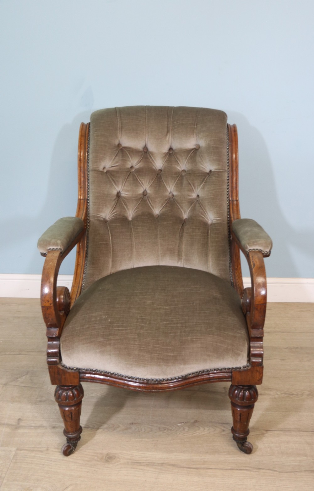 A six-piece late 19th-century chair suite featuring two button-back upholstered armchairs and four matching side chairs upholstered in taupe velvet with turned wooden front legs on castors. View XIII