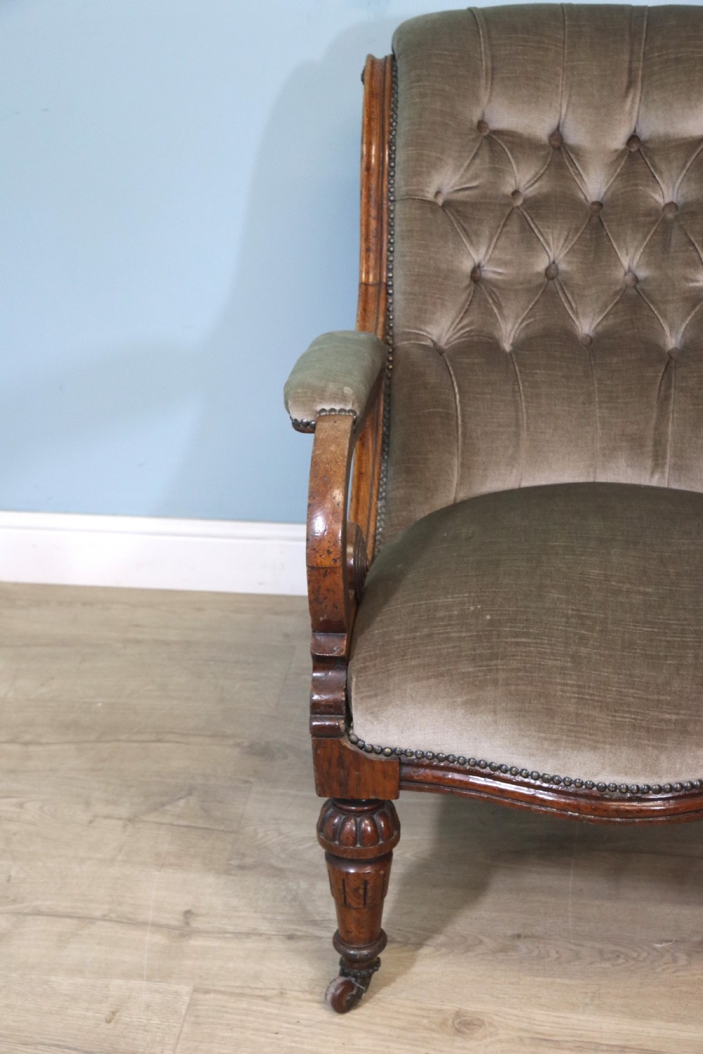 A six-piece late 19th-century chair suite featuring two button-back upholstered armchairs and four matching side chairs upholstered in taupe velvet with turned wooden front legs on castors. View XIV