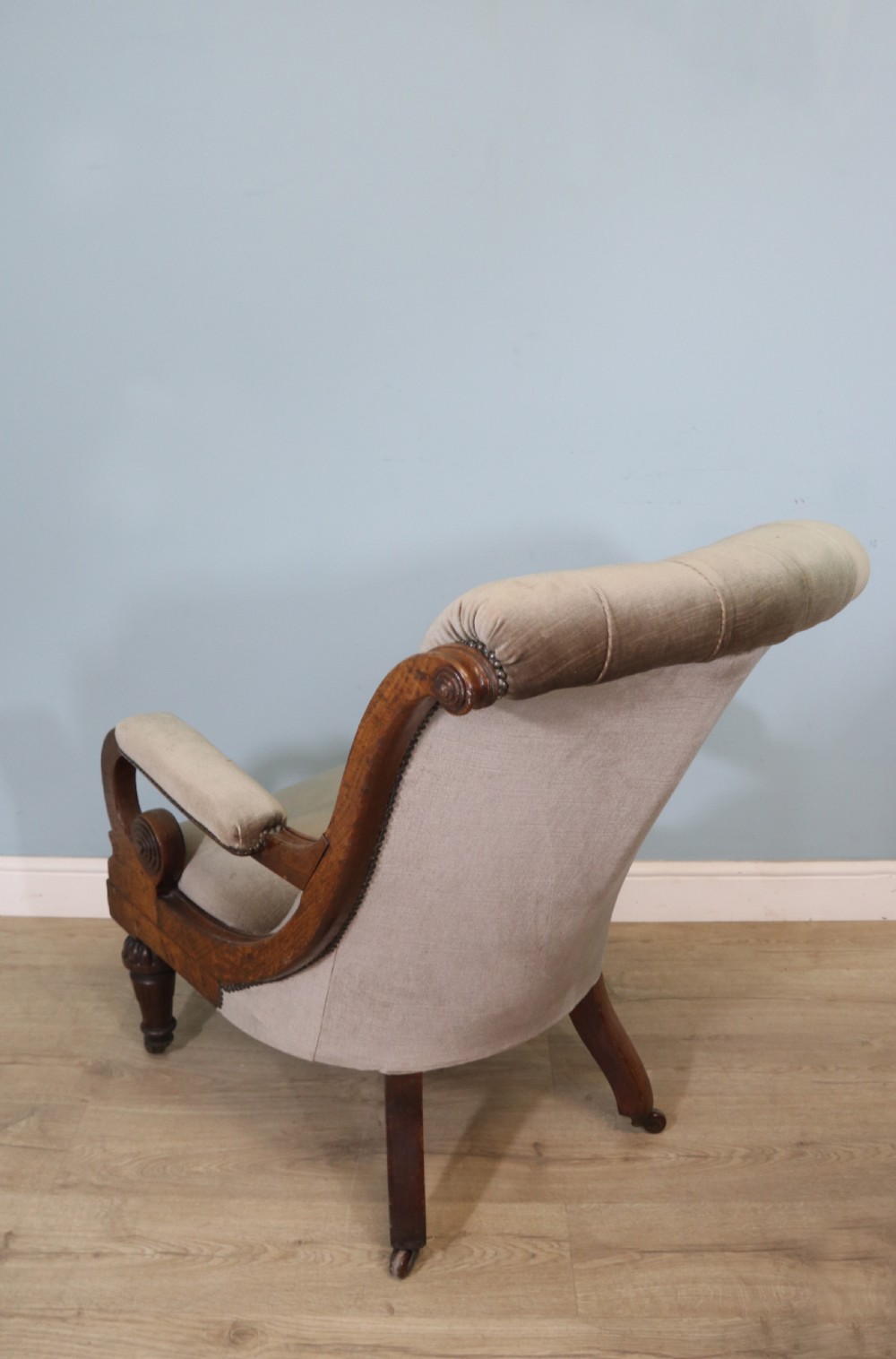 A six-piece late 19th-century chair suite featuring two button-back upholstered armchairs and four matching side chairs upholstered in taupe velvet with turned wooden front legs on castors. View XV