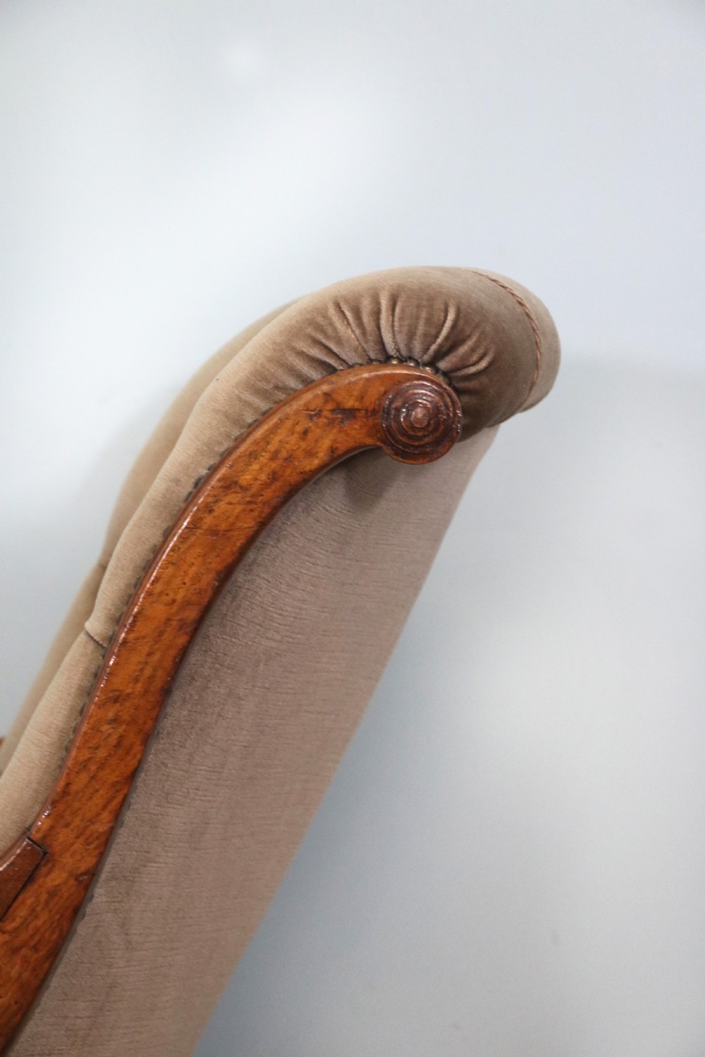 A six-piece late 19th-century chair suite featuring two button-back upholstered armchairs and four matching side chairs upholstered in taupe velvet with turned wooden front legs on castors. View XVI