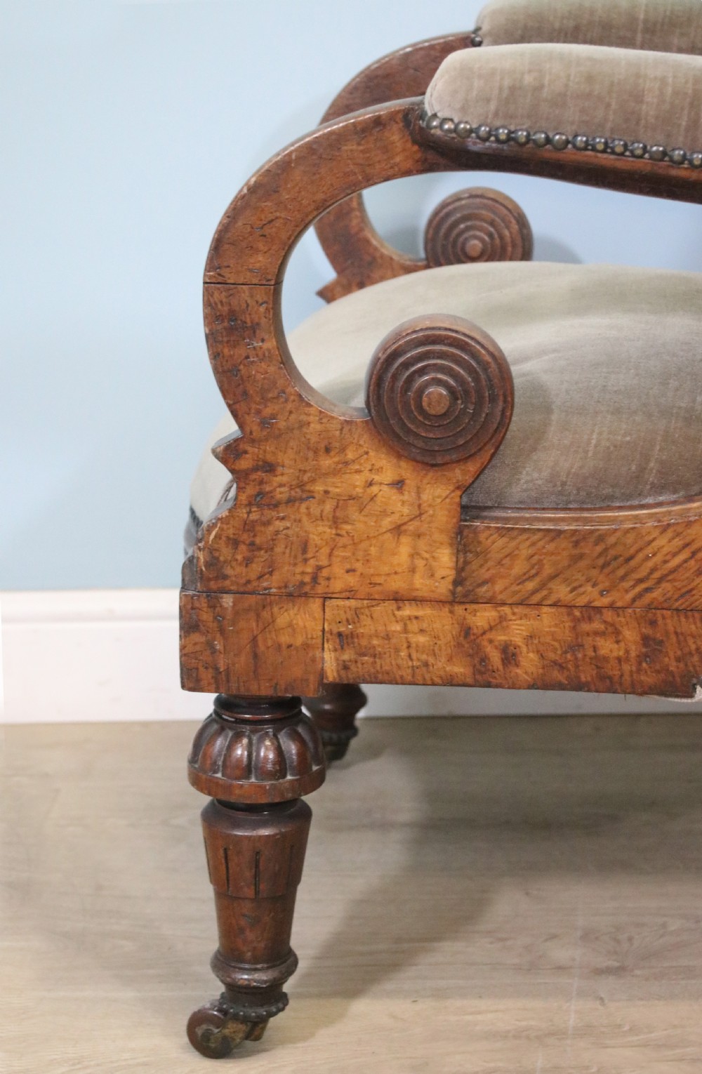 A six-piece late 19th-century chair suite featuring two button-back upholstered armchairs and four matching side chairs upholstered in taupe velvet with turned wooden front legs on castors. View XVII