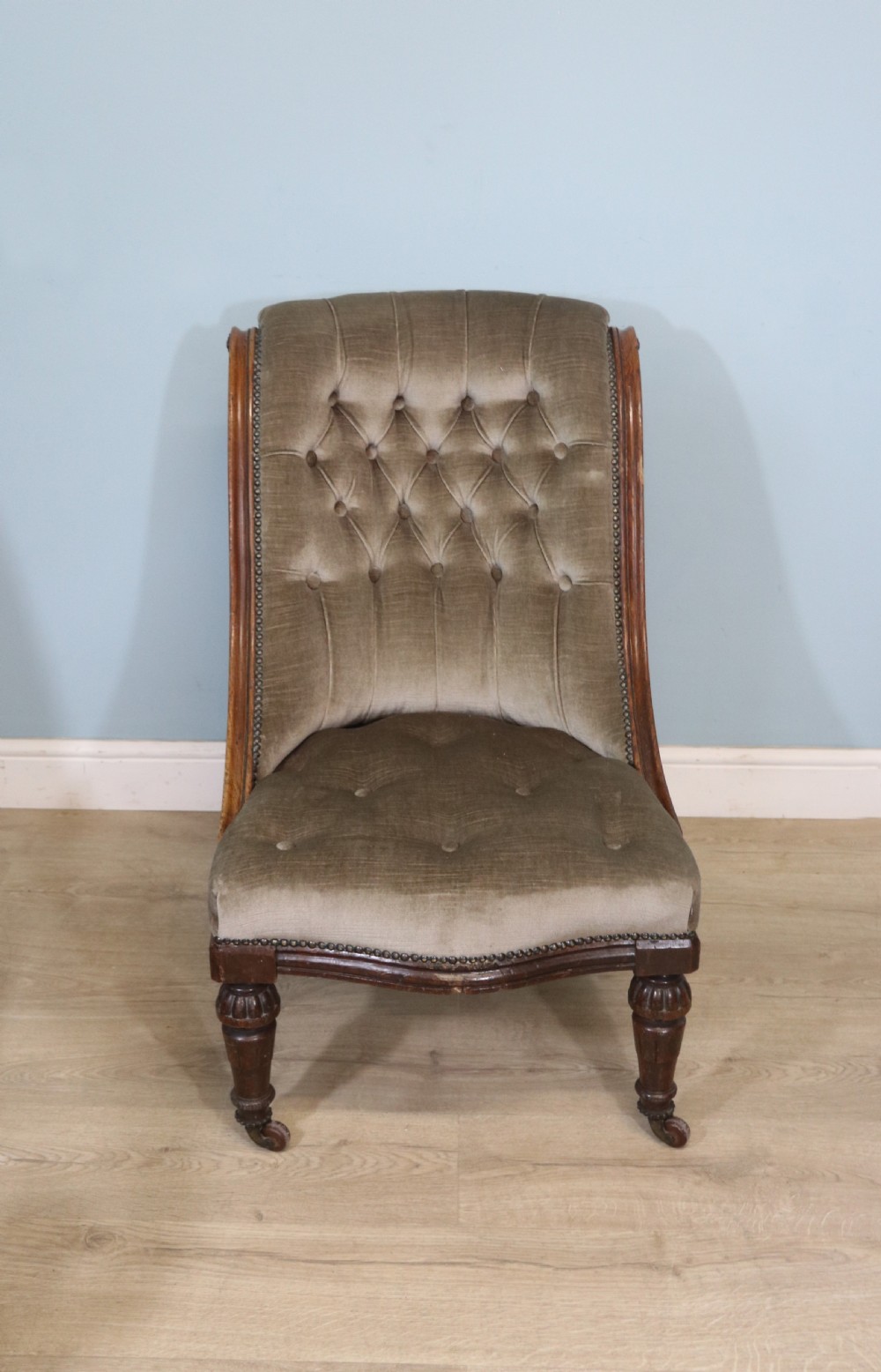 A six-piece late 19th-century chair suite featuring two button-back upholstered armchairs and four matching side chairs upholstered in taupe velvet with turned wooden front legs on castors. View XX