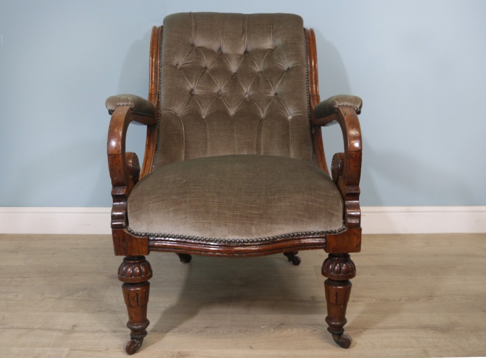 A six-piece late 19th-century chair suite featuring two button-back upholstered armchairs and four matching side chairs upholstered in taupe velvet with turned wooden front legs on castors. View XXII