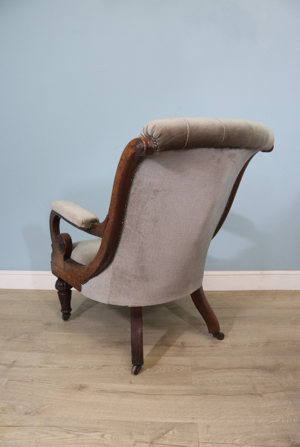 A six-piece late 19th-century chair suite featuring two button-back upholstered armchairs and four matching side chairs upholstered in taupe velvet with turned wooden front legs on castors. View XXIII